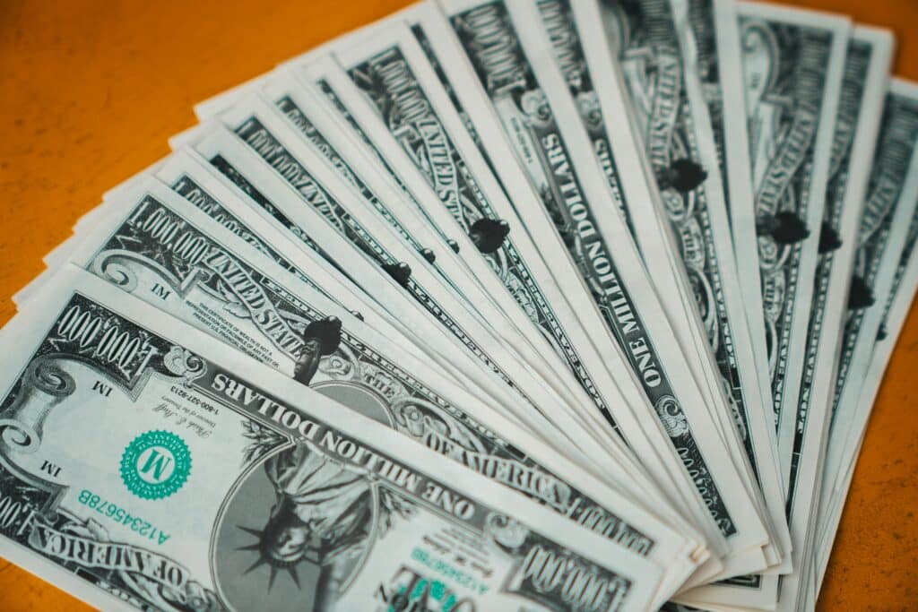 Closeup of novelty one million dollar bills laid out in a fan arrangement.