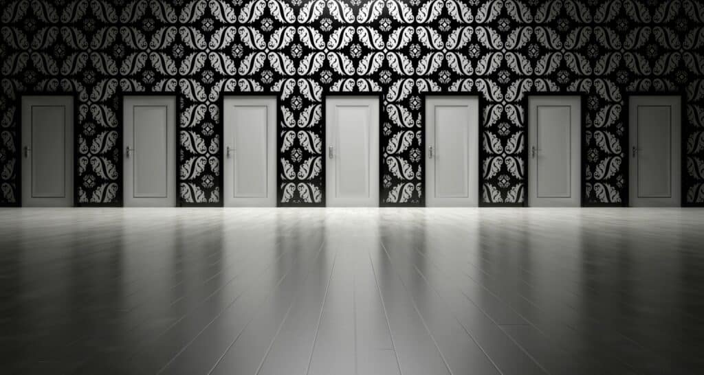 Five closed doors in a black and white ornate hallway symbolizing opportunities and decisions.