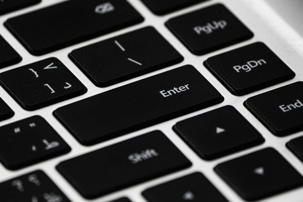High-resolution close-up of a black laptop keyboard emphasizing details and design.