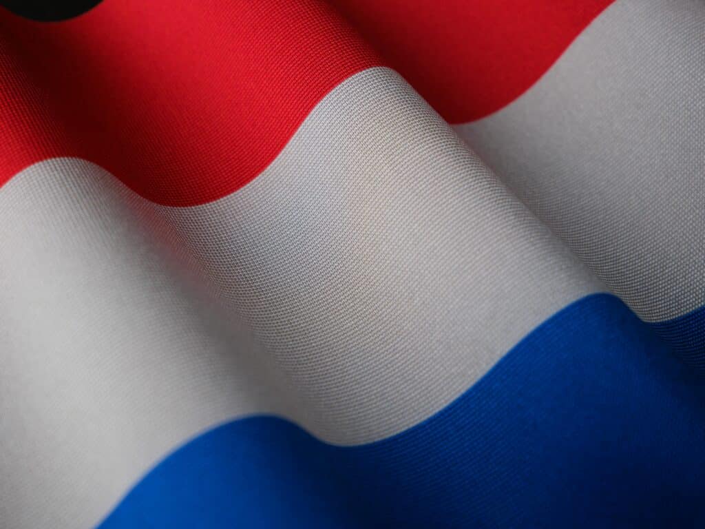 A detailed close-up of the Netherlands flag showcasing its vibrant colors and texture.